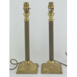A pair of brass column table lamps, 37cm high.