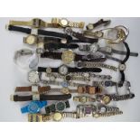 A large quantity of assorted men's and ladies wristwatches.
