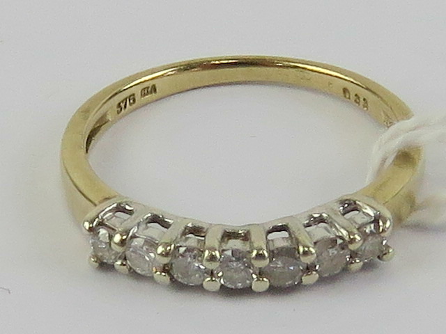 A 9ct gold and diamond half eternity ring, total 0.