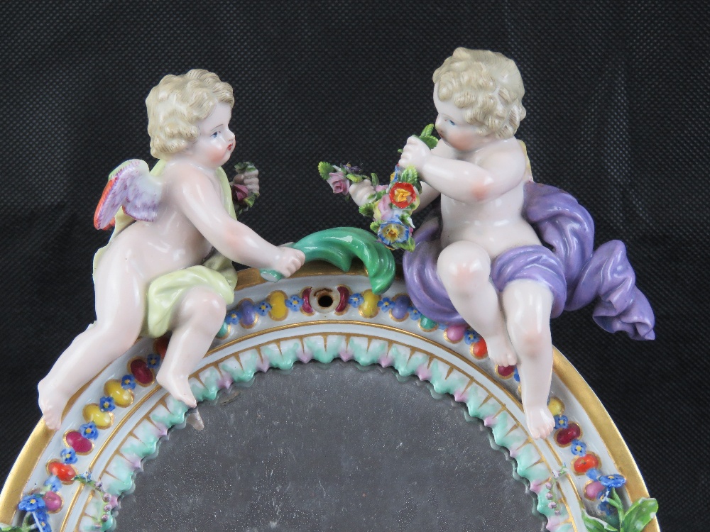 A late 19th century Continental floral encrusted oval easel mirror decorated with cherubs upon, - Image 2 of 3