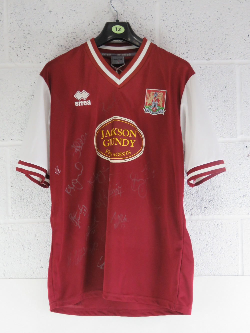 A Northampton Town Football Club 'Cobblers' 2011/12 full team signed football shirt, size XL.