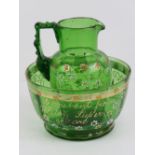 A Victorian handpainted green glass jug and bowl set 'a present from Weston Super Mare', bowl 11.