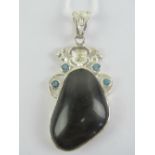 A 925 silver black agate and blue stone pendant, 6.7cm in length inc bale.