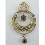 An Edwardian amethyst and seed pearl pendant, stamped 9ct, 3.8cm in length inc bale, 1.