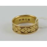 An 18ct gold wide band having Celtic style pattern upon, London hallmark, size Q, 5g.