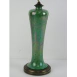 A green ceramic lamp base having brass base, for re-wiring, standing 31cm high.