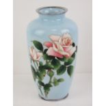 A delightful powder blue shoulder vase decorated with roses upon, having plated collar and base,