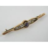 An Edwardian amethyst and seed pearl brooch, stamped 9ct, 5.3cm wide, 1.