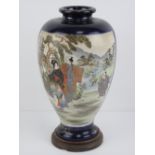 A early 20th century Japanese shoulder vase having twin decorative panels upon a cobalt blue ground,