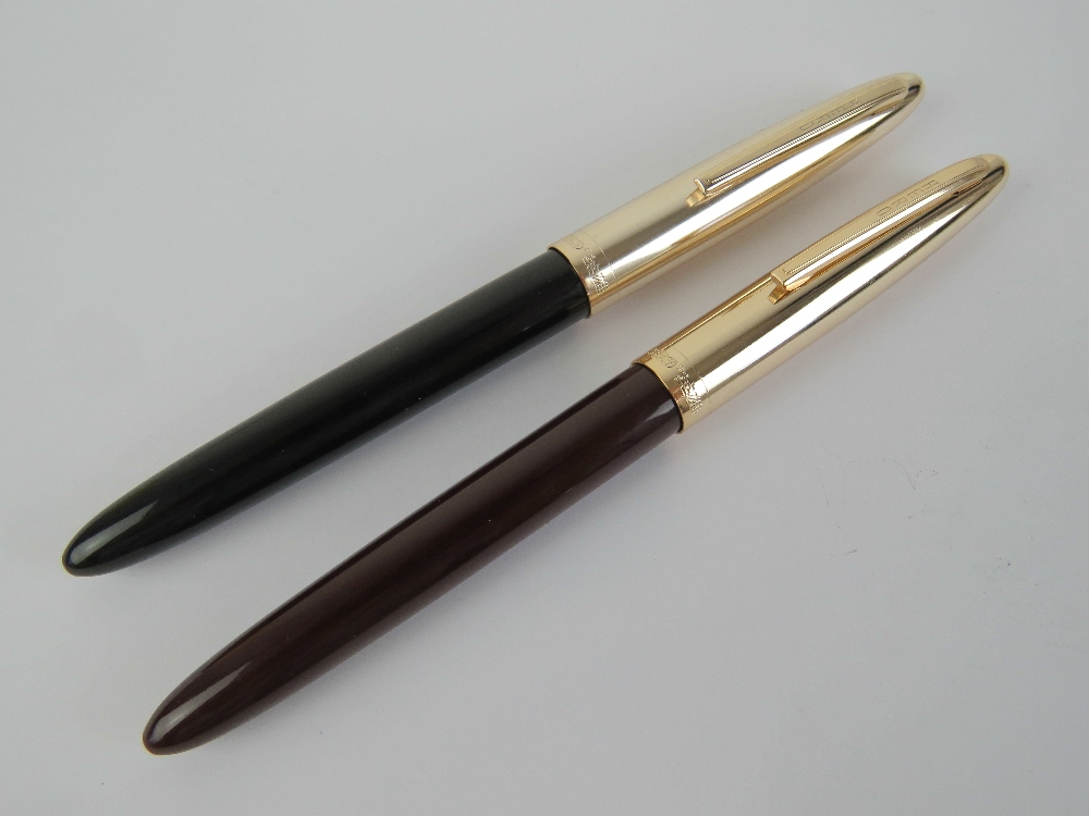 Two Hero '329' fountain pens with yellow metal nibs.