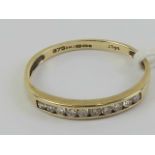 A 9ct gold and diamond half eternity ring, total 0.25ct of diamond, size P-Q, 1.2g.