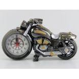 A contemporary clock in the form of a motorbike, 22cm in length.