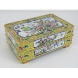 A Chinese Canton enamel on brass dressing table box having yellow ground with birds,