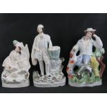 Staffordshire flatbacks; three assorted figurines ranging in size 26 - 35cm, a/f.