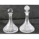 Two heavy cut glass 'ships' flat bottomed decanters, each with stopper.