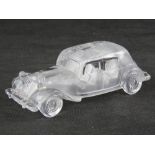 A glass paperweight in the form of a vintage Citroen motorcar, 19cm in length.