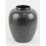 A Mid 20th century Poole Pottery black lustre vase standing 22cm high.