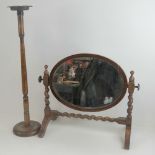 A c1930s stained oak smokers receptacle on stand, together with an oval toilet mirror on stand.