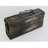 A WWII German MG34/42 E tin to hold a gunners Waffenmeister tool kit, with marks upon.