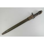 A WWI US P17 Remington bayonet dated 1917, with scabbard and leather frog, blade measuring 43cm.