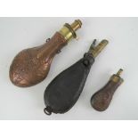 A copper and brass powder flask marked G. & J. W.