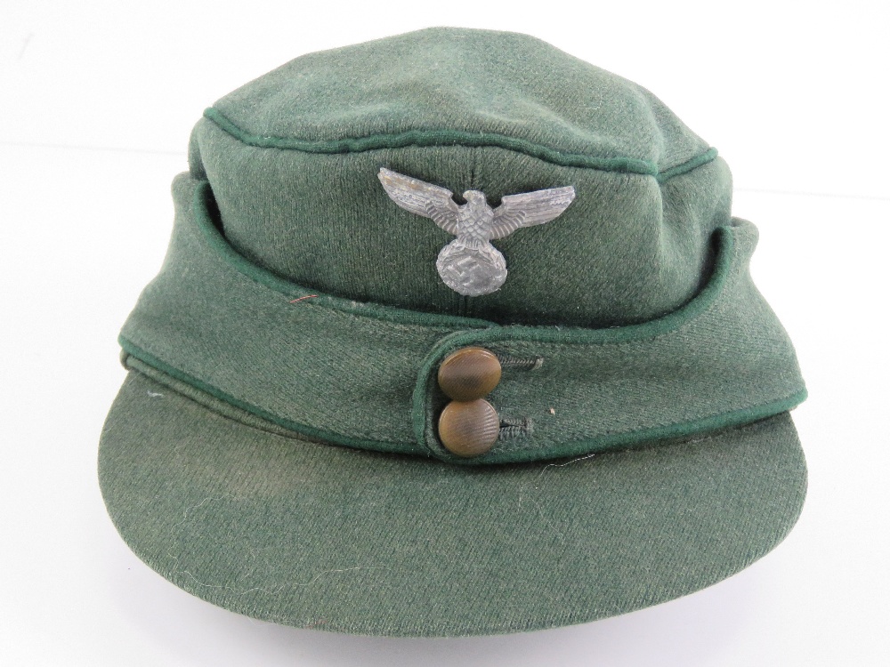 A German M43 cap having eagle and swastika metal badge upon. - Image 2 of 5