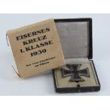 A WWII German Iron Cross 2nd class, in box with card sleeve, with backing.