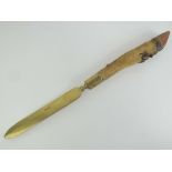 A decorative brass knife having deer slot handle measuring 57cm in length.