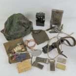 A quantity of assorted militaria; K98 cleaning kit, reproduction SS helmet cover, bayonet frog,