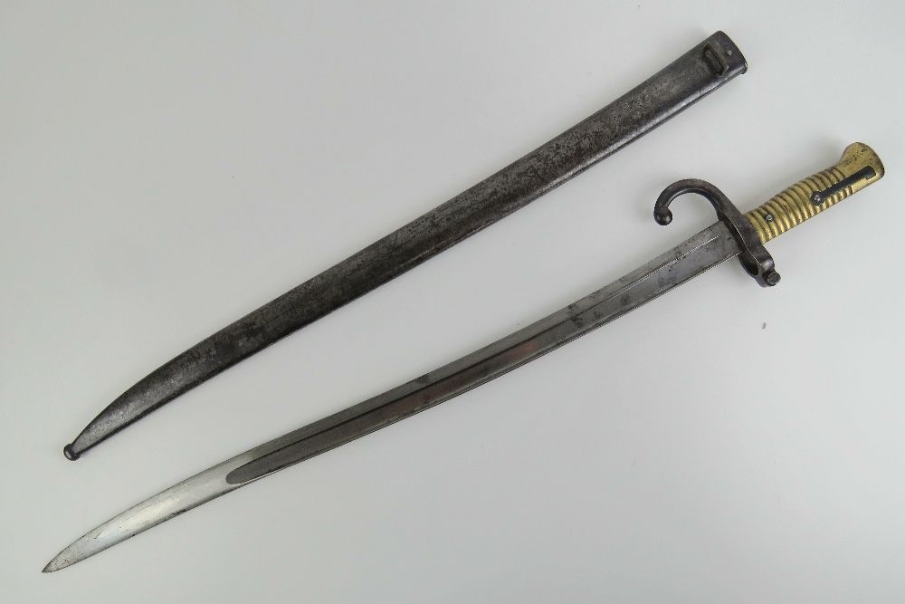 A Remington rolling block bayonet with brass grip, 57cm blade, with quillian, with scabbard. - Image 2 of 7
