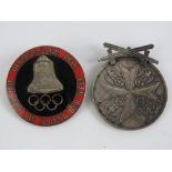 An enamelled 1936 Berlin Olympics badge having makers mark to back and Third Reich medal. Two items.