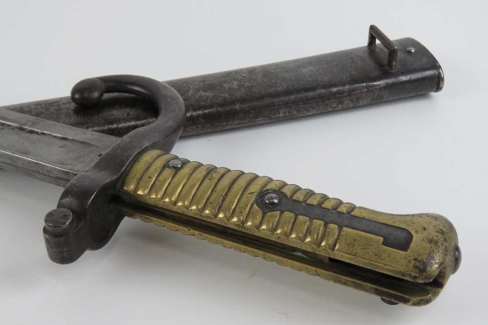 A Remington rolling block bayonet with brass grip, 57cm blade, with quillian, with scabbard. - Image 7 of 7