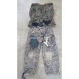 A reproduction WWII German SS camouflage jacket with camouflage Y straps, gloves and trousers.