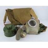 A Russian gas mask with canister and bag.