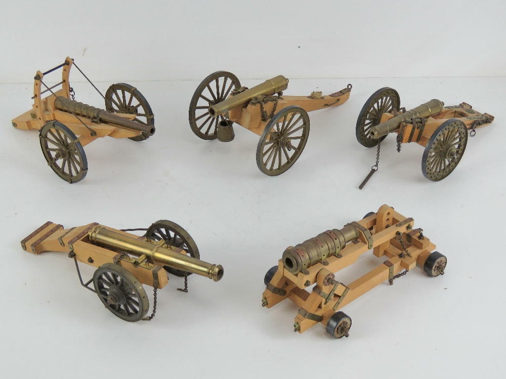 Five decorative cannons each approx 21cm in length.