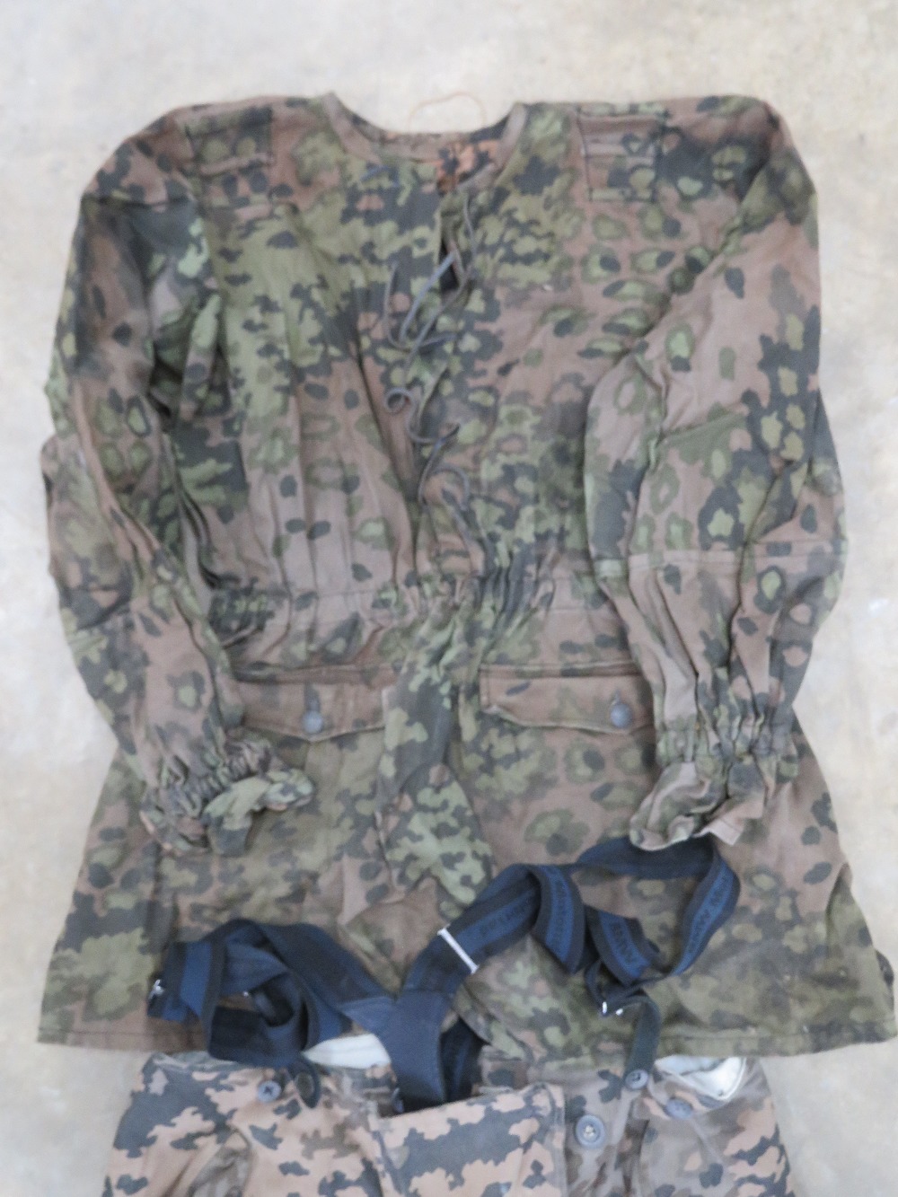 A reproduction WWII German SS camouflage jacket with camouflage Y straps, gloves and trousers. - Image 2 of 4