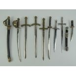 A miniature decorative sword modelled on US 1860 pattern with leather sheath, total length 26cm,