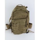 A military back pack with multiple pockets, un-issued condition.