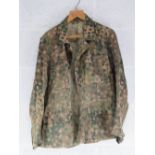 A reproduction WWII German SS dot camouflage tunic.