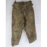 A pair of reproduction WWII German SS dot camouflage trousers.