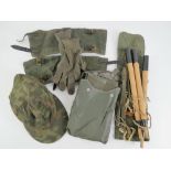 A quantity of assorted reproduction WWII German items; double sided SS camo cap, gloves,