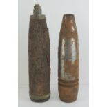 Two inert shells with heads in relic condition.