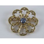 A 9ct gold floral Edwardian style brooch having central cornflower blue sapphire approx 0.4ct (4.