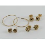 Two pairs of hallmarked 9ct gold stud earrings being an abstract floral pair and a Celtic knot pair,