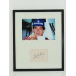 Ayrton Senna; hand-signed autograph on card in photographic montage. Measuring 36 x 30cm.