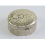 A 925 silver pill pot, hinged lid having floral engraving upon. 3cm diameter.