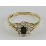 A 9ct gold sapphire and cz floral cluster ring, hallmarked 375, size O, 1.9g.