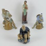 Four Oriental pottery figurines, three being of fishermen, 14cm-22cm high respectively.