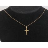 A 9ct gold crucifix on 9ct gold fine chain, pendant 2.
