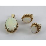 To match above Lot; a 9ct gold opal pendant, red/green fire, with associated stud earrings.